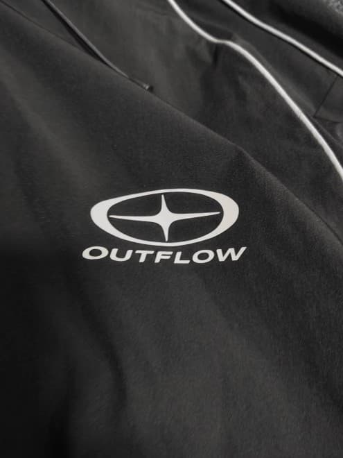 Close detail of OUTFLOW® fabric and logo construction